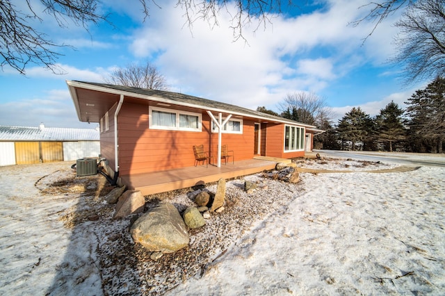 exterior space featuring central AC unit and a wooden deck