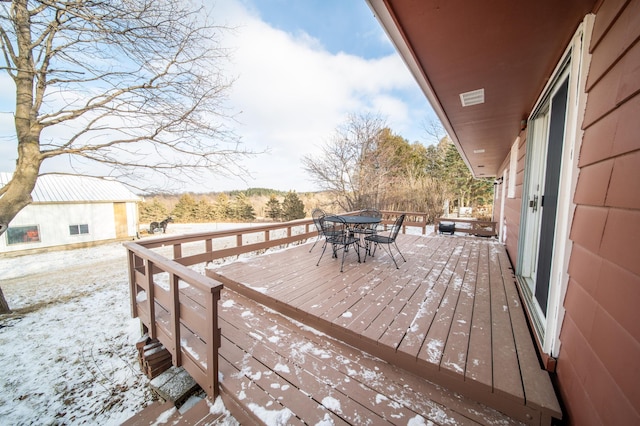 view of snow covered deck