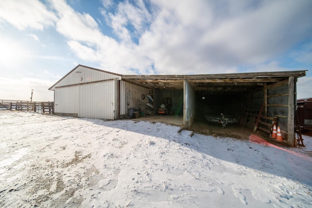 view of snow covered garage