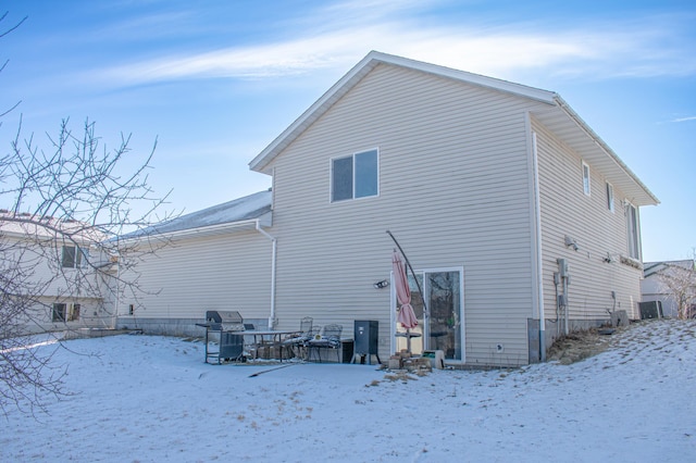 view of snow covered house