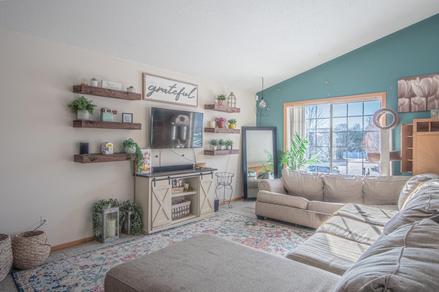 living room with lofted ceiling and a textured ceiling