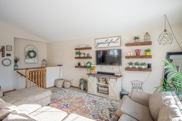 living room featuring lofted ceiling