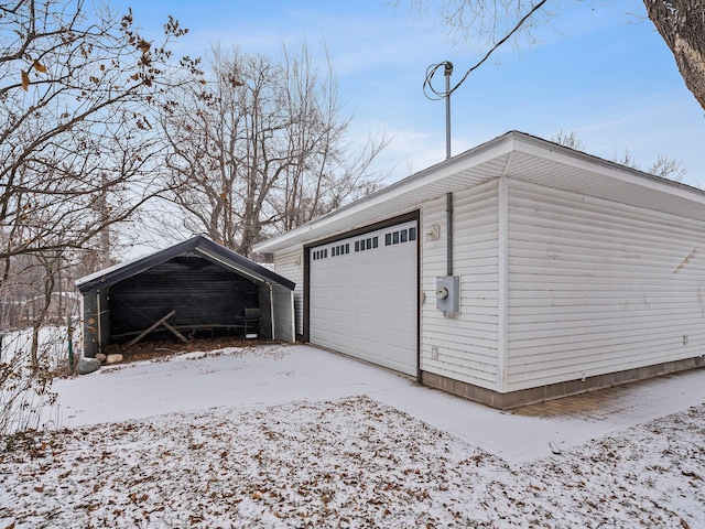 view of snow covered garage