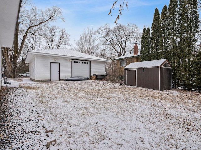 view of snow covered garage