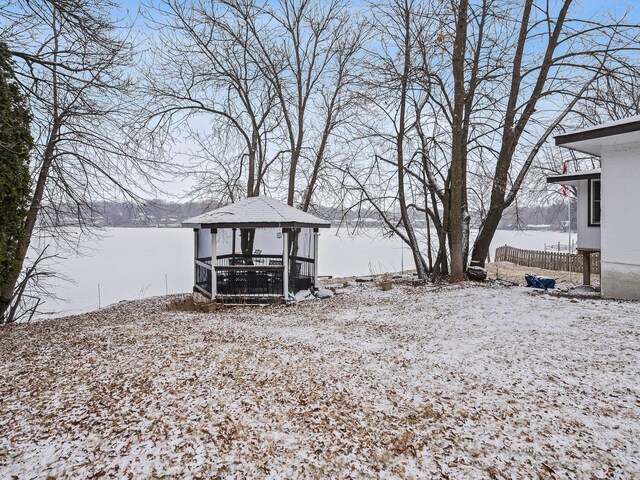 snowy yard featuring a gazebo