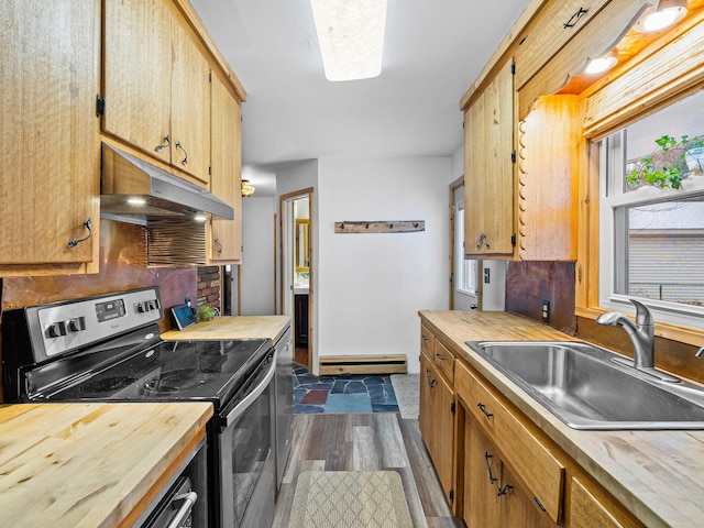 kitchen featuring dark hardwood / wood-style flooring, sink, stainless steel appliances, and a baseboard heating unit