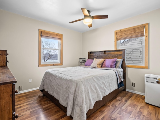 bedroom with ceiling fan and dark hardwood / wood-style floors