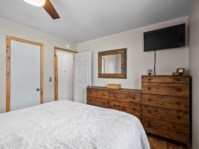 bedroom featuring ceiling fan and dark wood-type flooring