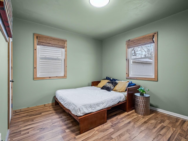 bedroom with hardwood / wood-style floors