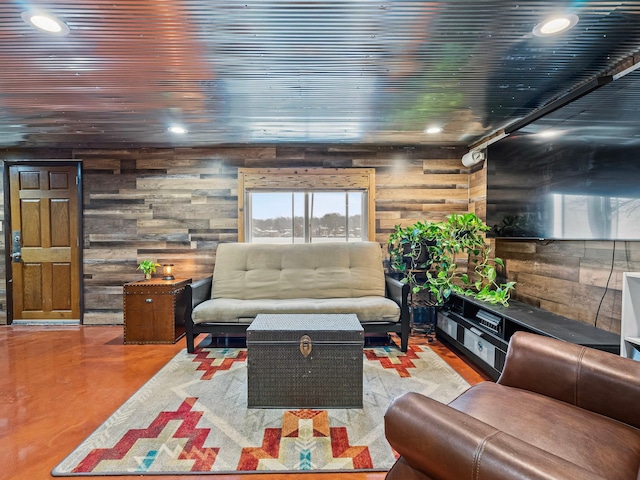 living room featuring wood walls