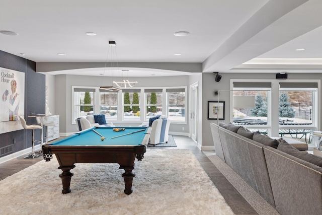 game room featuring a notable chandelier, light hardwood / wood-style floors, and pool table