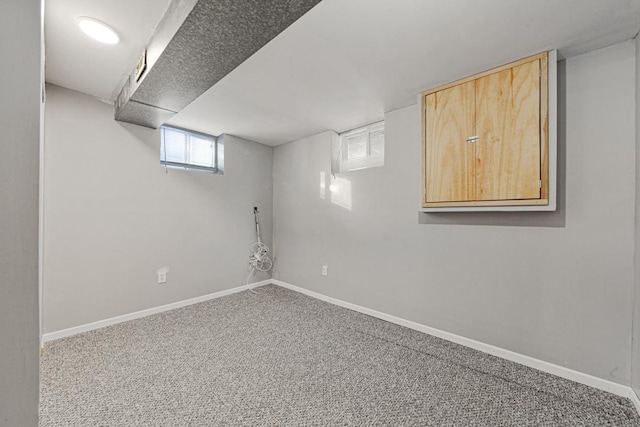 basement featuring carpet flooring