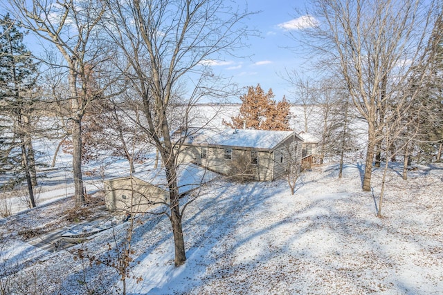 view of yard layered in snow