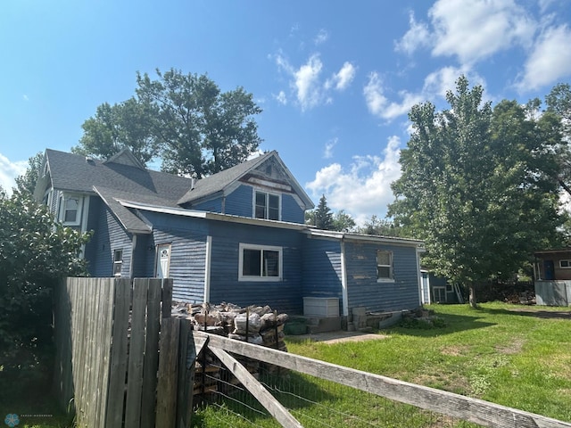 view of home's exterior featuring a lawn