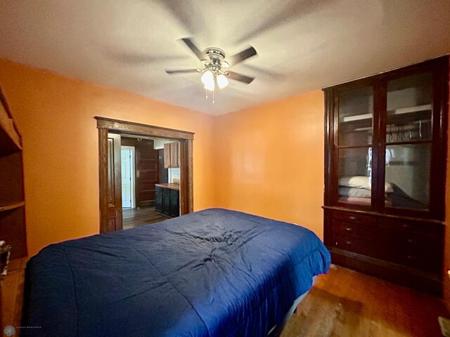 bedroom featuring ceiling fan and dark hardwood / wood-style floors