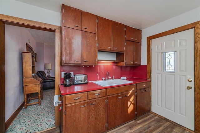 kitchen featuring sink and dark hardwood / wood-style floors