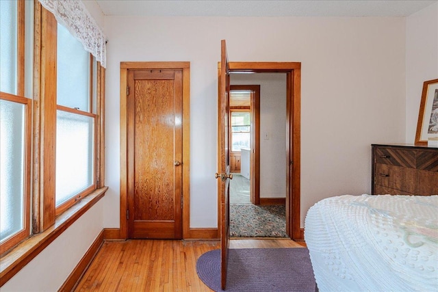 bedroom with light hardwood / wood-style floors