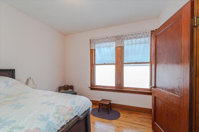 bedroom with light wood-type flooring