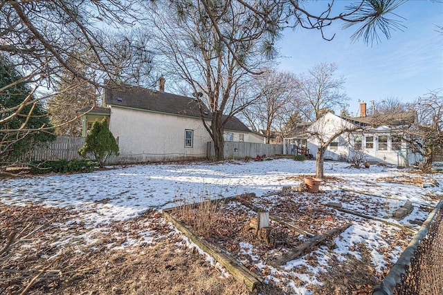 view of yard layered in snow