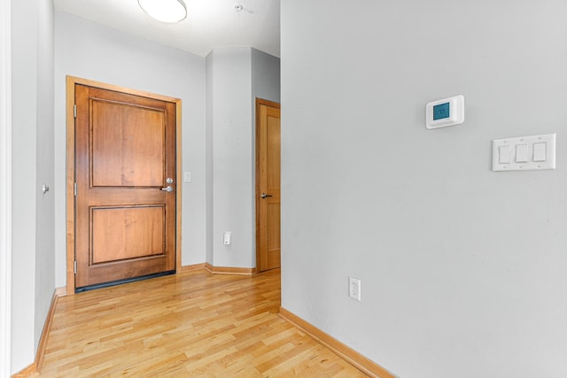 hall with light wood-type flooring