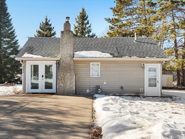 rear view of house featuring a patio area and french doors