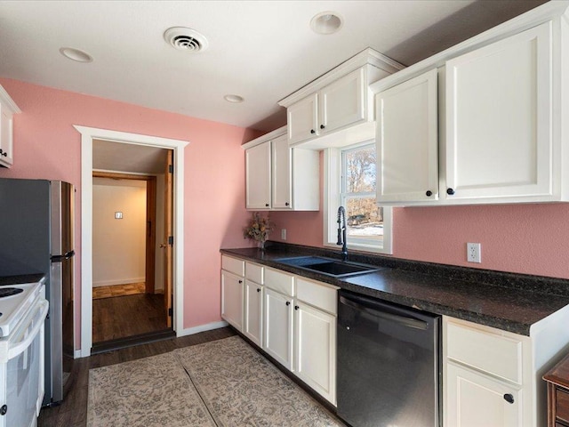 kitchen featuring white cabinetry, stove, and black dishwasher