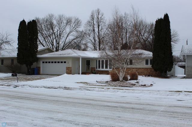 single story home featuring a garage