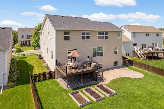 back of house with a lawn, central AC, and a deck