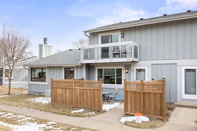 rear view of house with a balcony