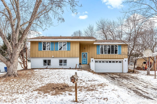 bi-level home featuring a garage