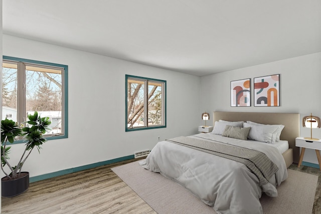 bedroom with light hardwood / wood-style flooring