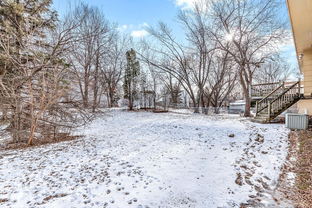 view of yard layered in snow