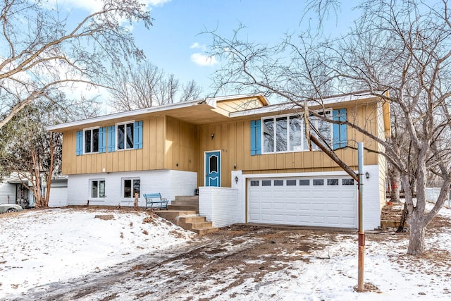 bi-level home featuring a garage