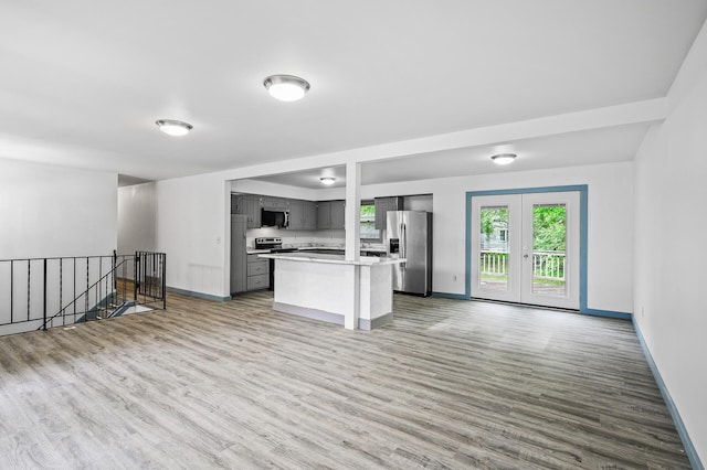 1813 Stinson Blvd, New Brighton, MN 55112 - kitchen with stainless steel appliances, gray cabinetry, baseboards, and light wood-style flooring