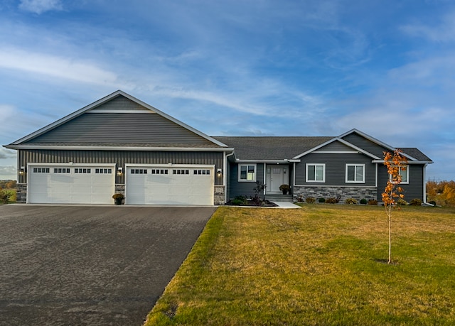 view of front of home with a garage and a front yard