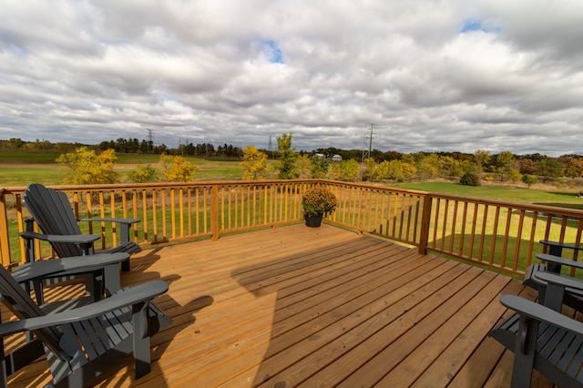 wooden deck with a lawn