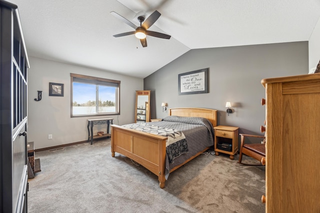 carpeted bedroom with ceiling fan and lofted ceiling