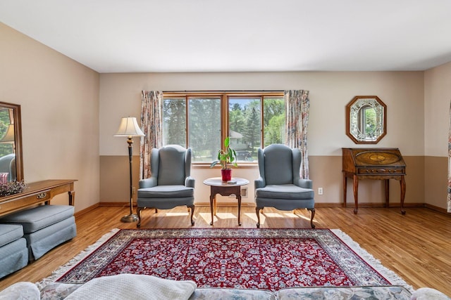 living area featuring wood finished floors and baseboards