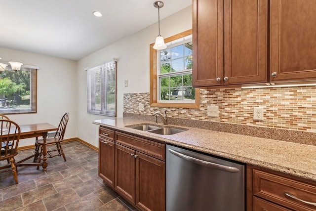 kitchen with stainless steel dishwasher, a sink, healthy amount of natural light, decorative backsplash, and recessed lighting