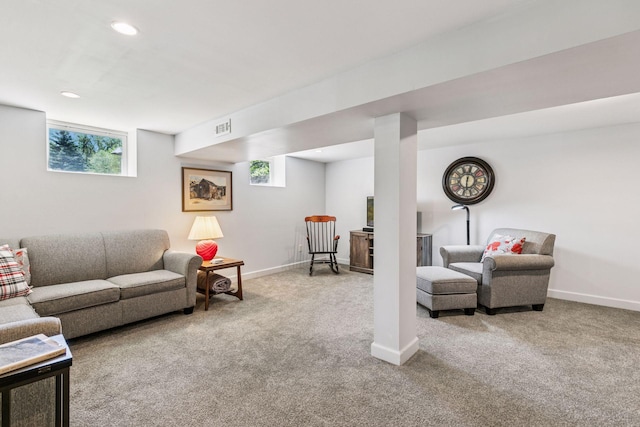 carpeted living area featuring baseboards and recessed lighting
