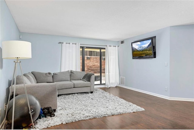 living room featuring dark hardwood / wood-style flooring