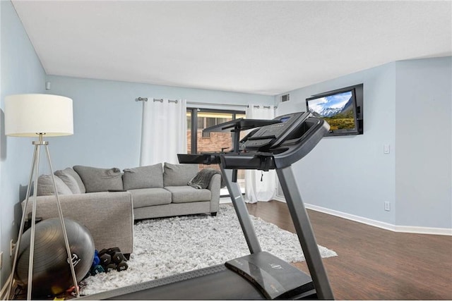 exercise area featuring dark hardwood / wood-style floors