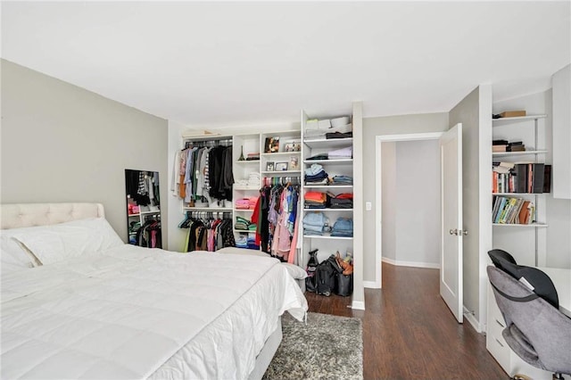 bedroom with a closet and dark wood-type flooring