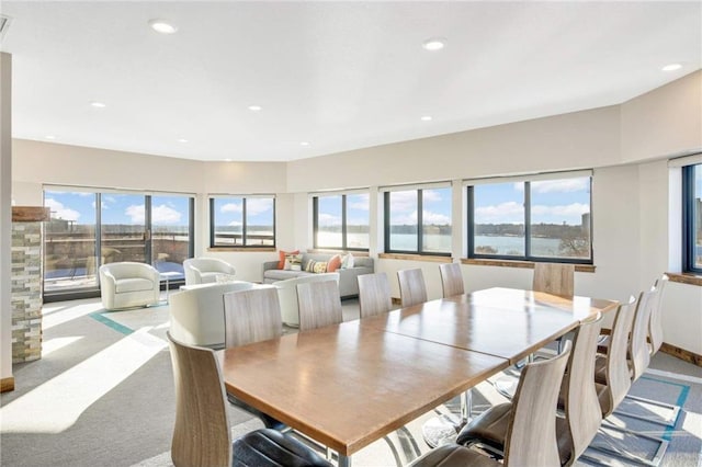 dining area featuring light colored carpet