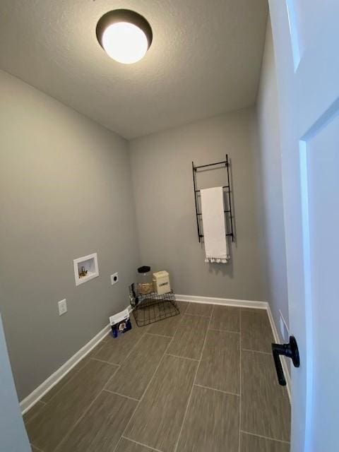 clothes washing area featuring hookup for an electric dryer and hookup for a washing machine