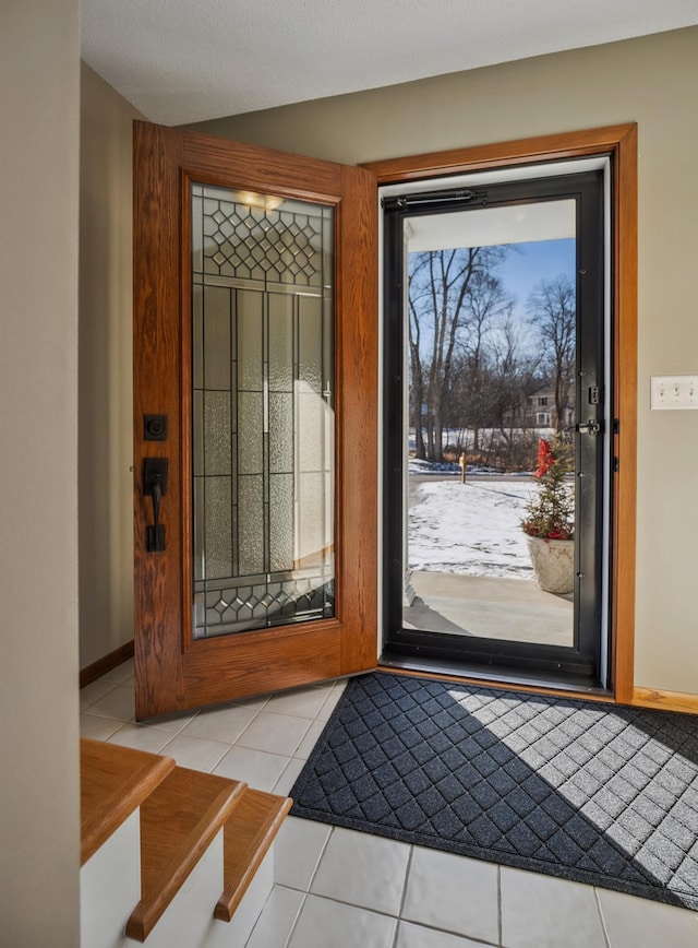 entryway featuring light tile patterned floors