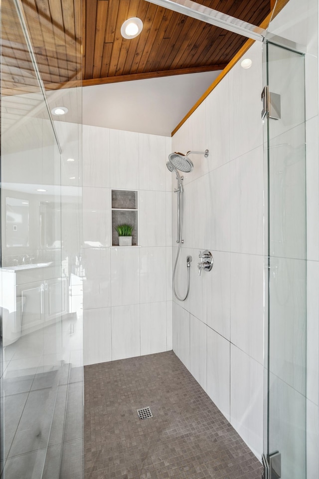 bathroom with wood ceiling, lofted ceiling, and an enclosed shower