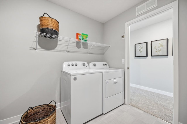 laundry area featuring washing machine and dryer