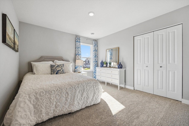 carpeted bedroom featuring a closet