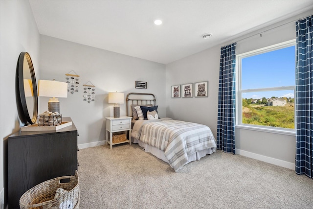 bedroom featuring light colored carpet